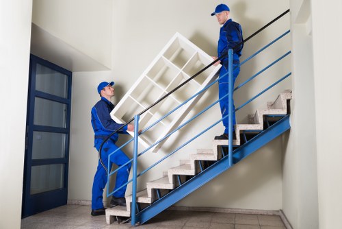 Professional packing services in Sudbury organizing moving boxes in a home