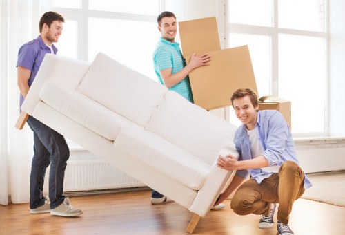 Professional movers loading items for a local Sudbury move