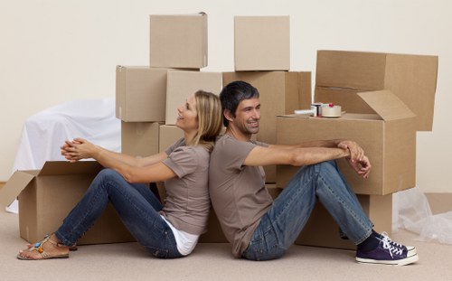 Careful wrapping of fragile items by packing professionals in Sudbury